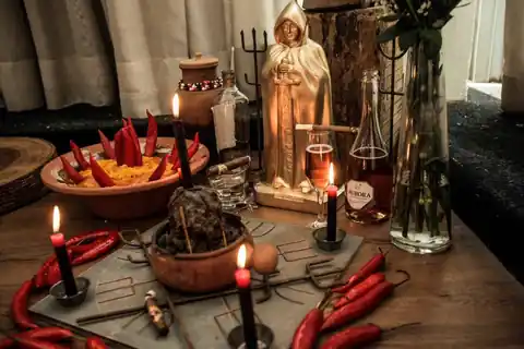 Oferenda com velas, pimentas e bebidas em um altar